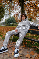 PANTALON DE SURVÊTEMENT EN JEAN DÉCHIRE LE COTON WREATH GRIS